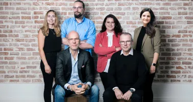 Gruppenbild mit Mitarbeitern der Evex Group